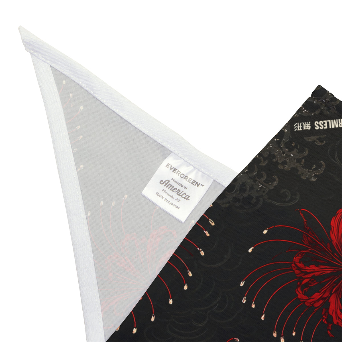 HIGANBANA dog bandana in black with all-over red spider lily print, corner detail with hem and care label | Formless