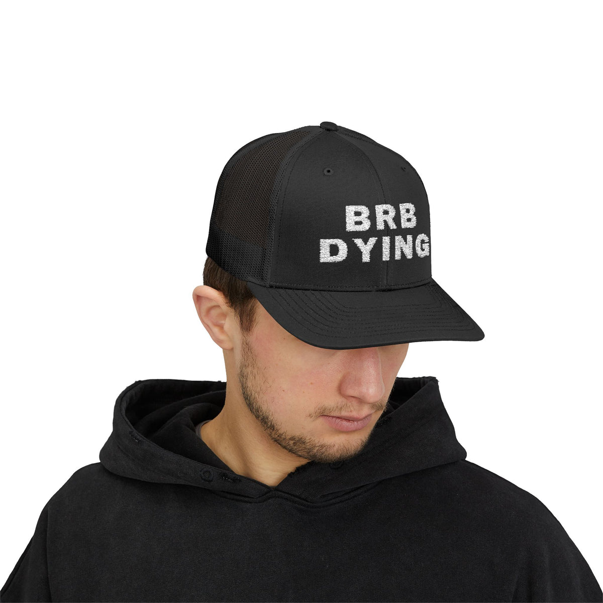 BRB DYING embroidered trucker cap in Black with white BRB DYING embroidery on the front – worn, front | Formless