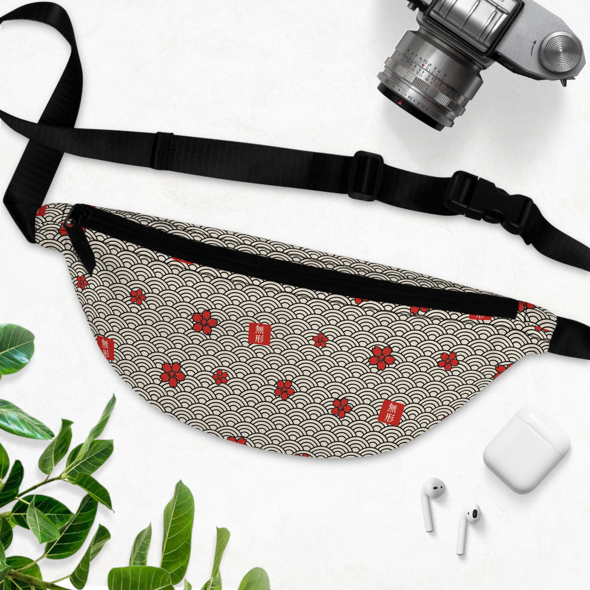 MUKEI all-over print fanny pack with seigaiha waves, red sakura and 無形 stamps on bone – flat lay | Formless