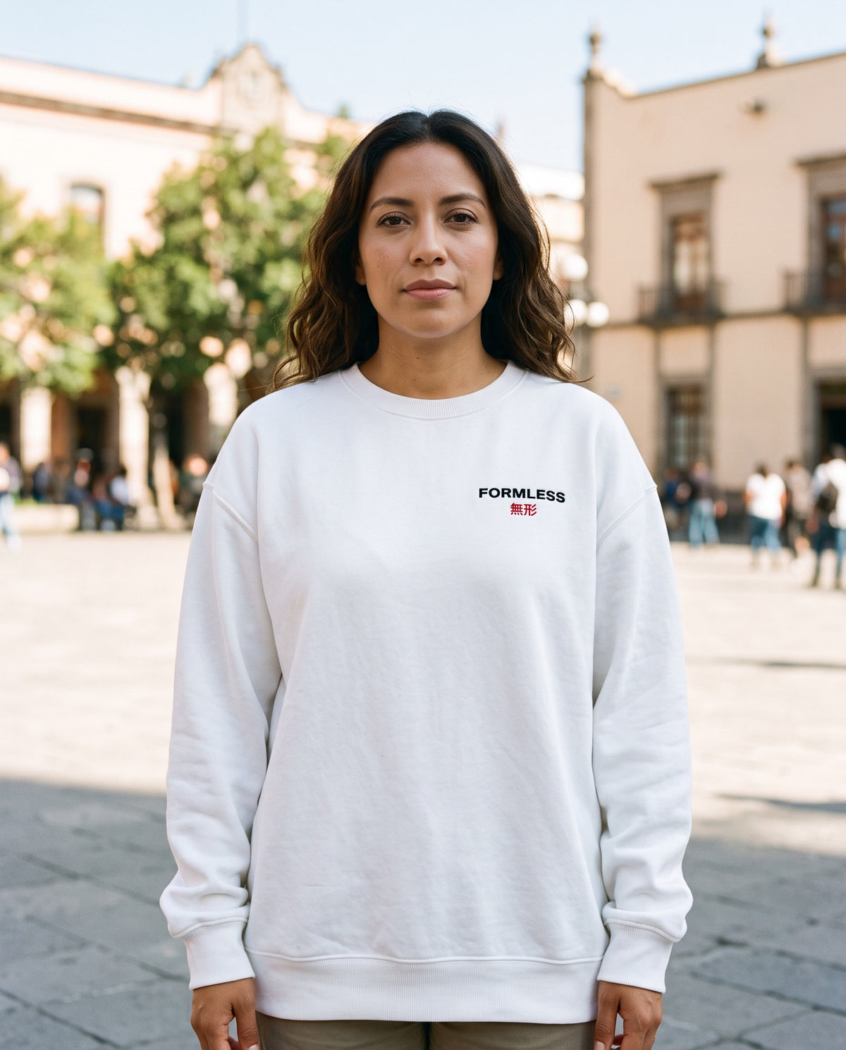 FORMLESS 無形 embroidered logo crewneck in white, front view, worn by a woman