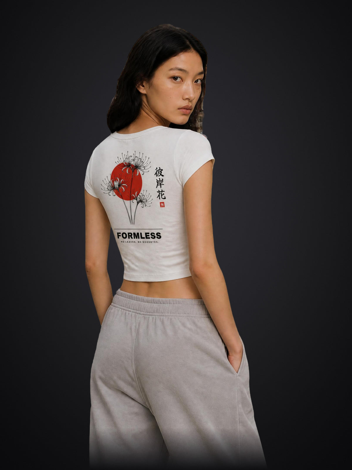 HIGANBANA women's cropped baby tee in White, worn by a model, back view with red spider lily and red sun print | Formless