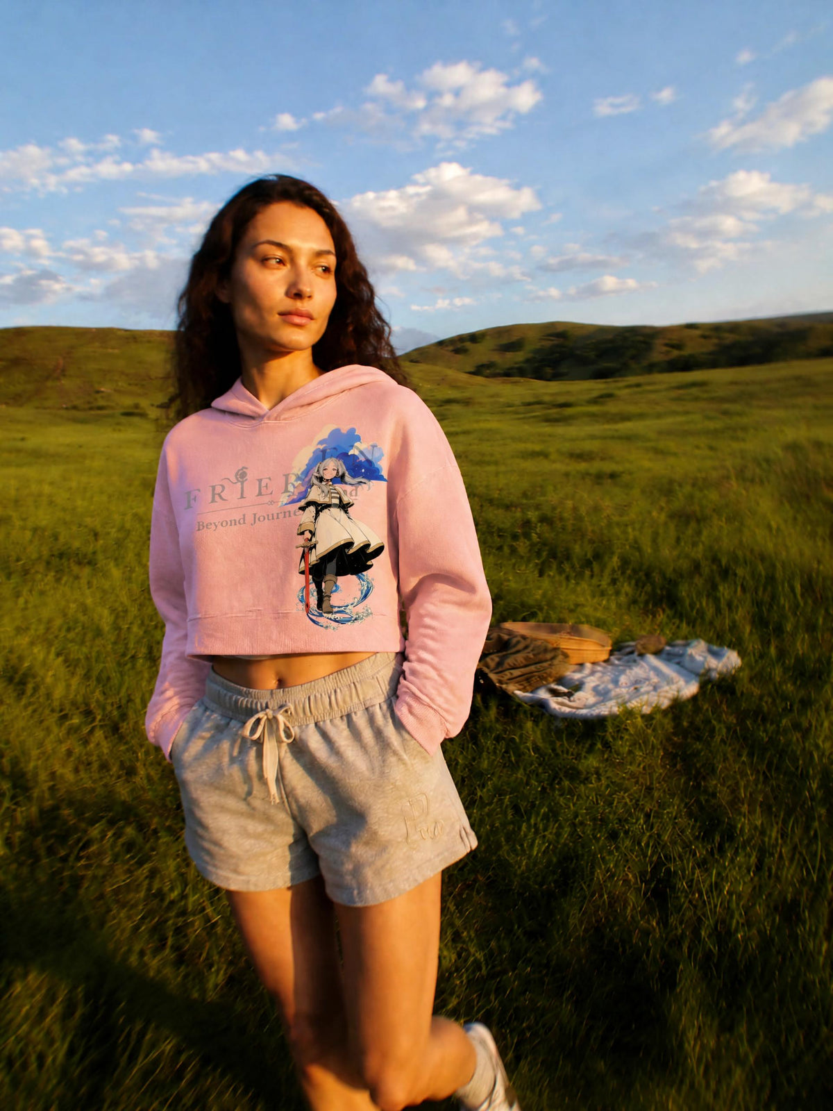 Women's vintage wash cropped hoodie in Pink, worn by a model in a grassy field, front view | Formless