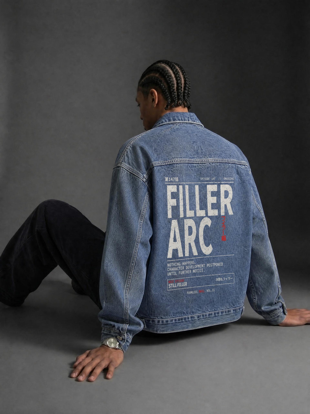 FILLER ARC vintage wash zip-up denim jacket in Blue, worn by a seated model, back view with FILLER ARC print | Formless