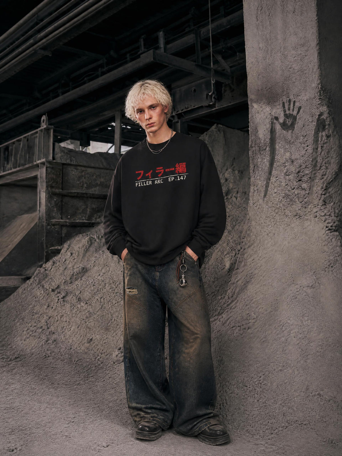 FILLER ARC oversized knit collar sweatshirt in Black, worn by a model with washed baggy jeans, front view | Formless