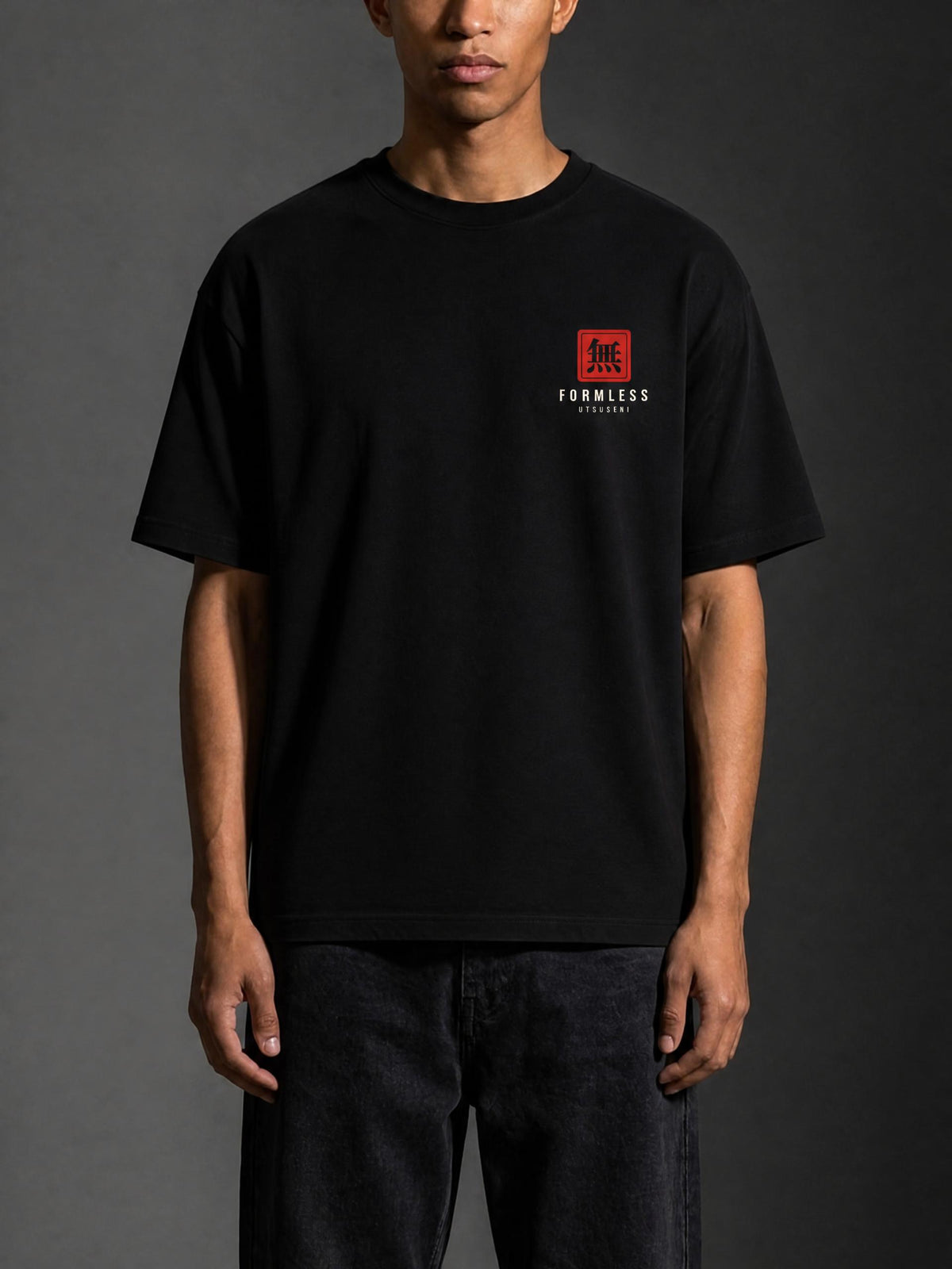 UTSUSEMI heavyweight boxy graphic tee in Black, worn by a model, front view with small red chest logo | Formless