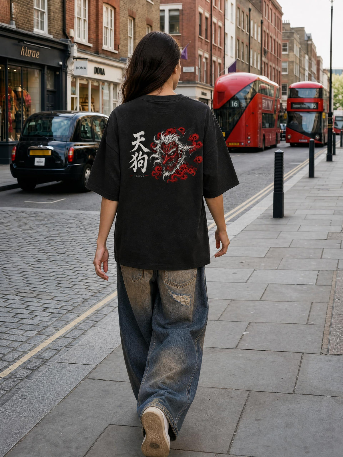 TENGU 天狗 heavyweight tee in Black worn by a model on a city street, back view with tengu mask and 天狗 print | Formless