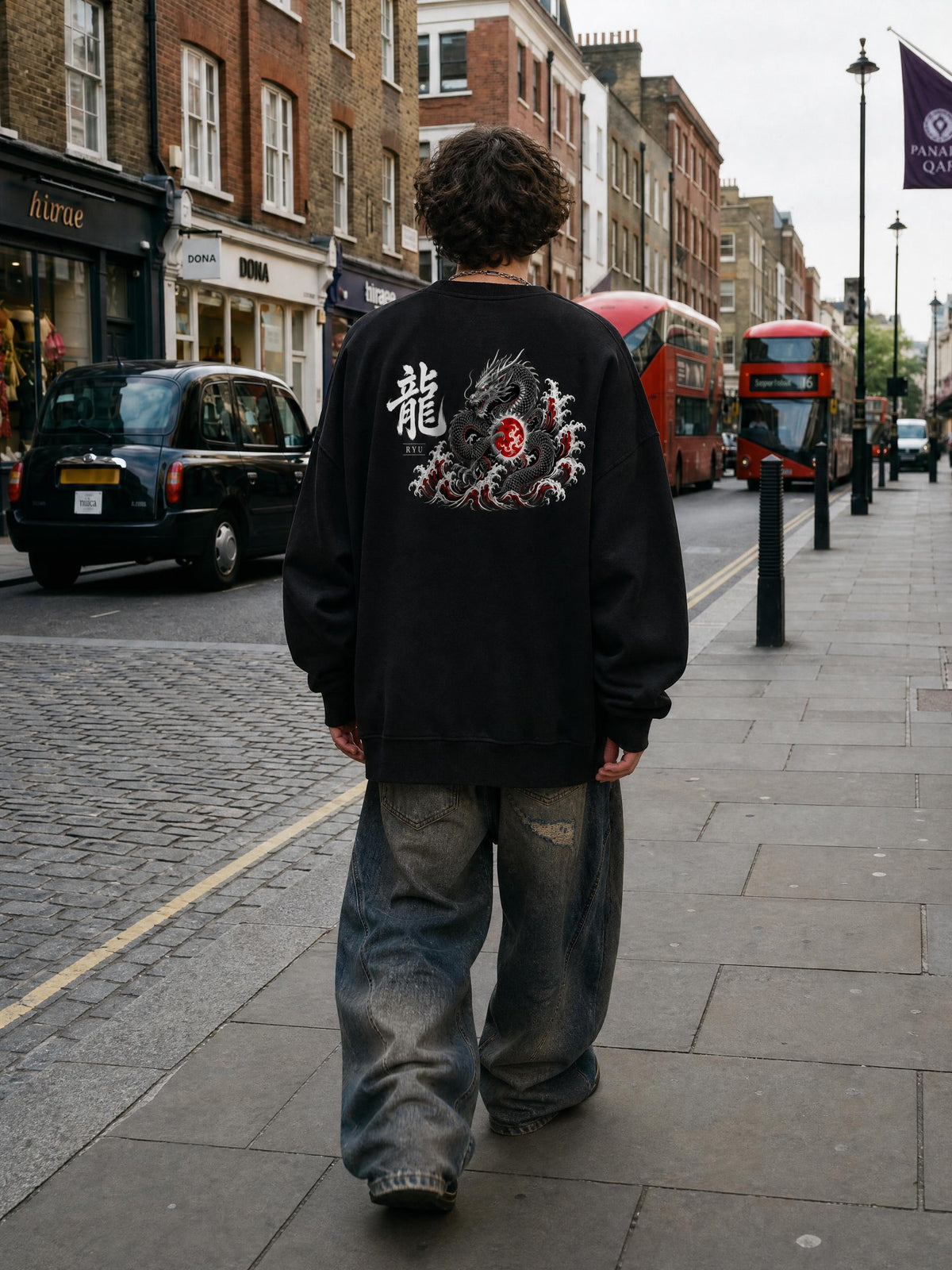 RYŪ 龍 distressed sweatshirt in Black worn by a model on a city street, back view with dragon and 龍 print | Formless
