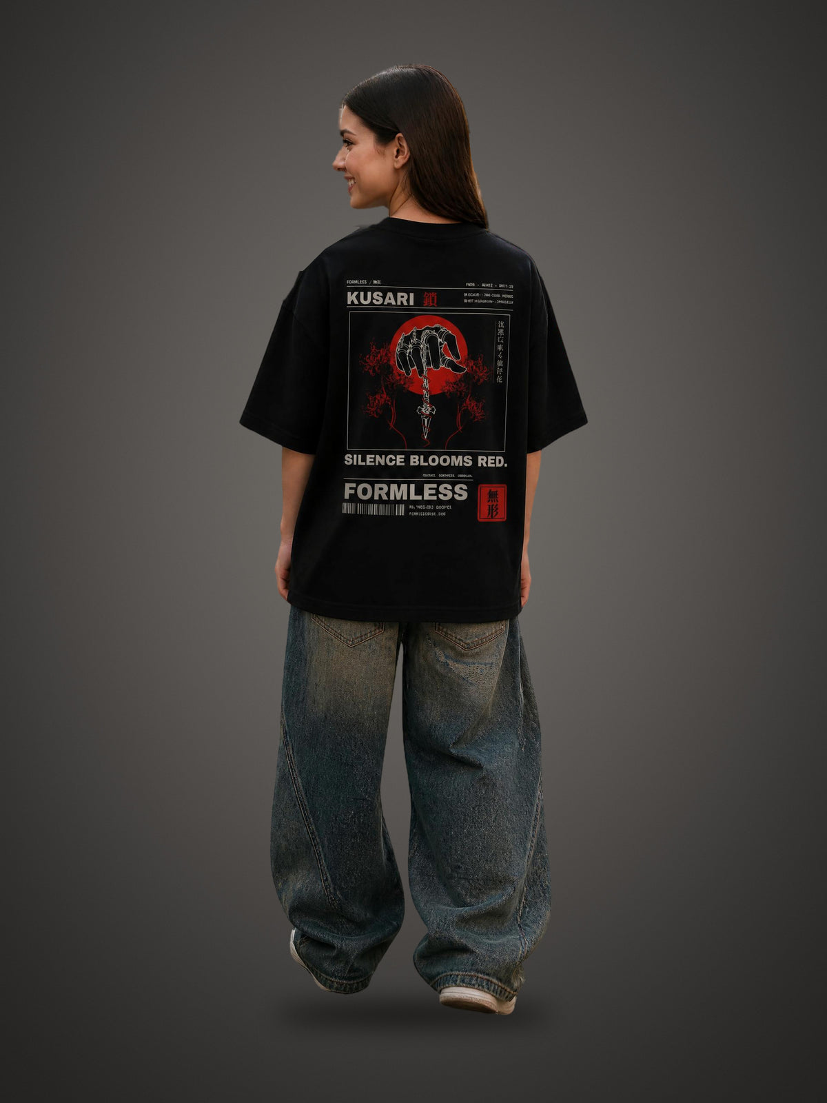 KUSARI heavyweight boxy tee in Black worn by a model, back view with chained hand, dagger, red sun and spider lily print | Formless
