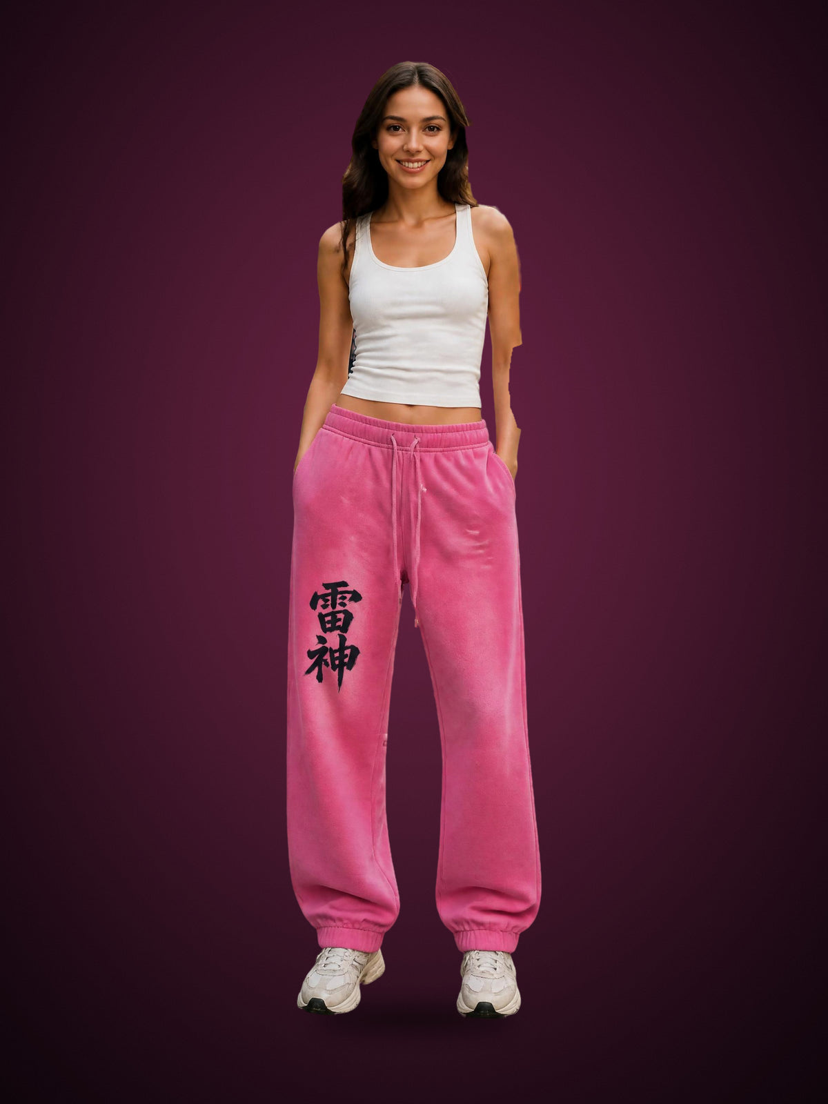 RAIJIN 雷神 fleece sweatpants in Rose Pink worn by a model, front view with vertical 雷神 kanji print | Formless