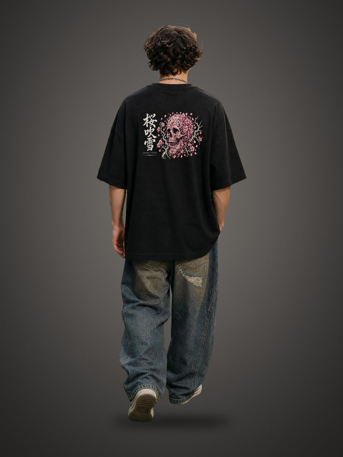 SAKURA FUBUKI 桜吹雪 heavyweight tee in Classic Black worn by a model, back view with cherry blossom storm skull print | Formless